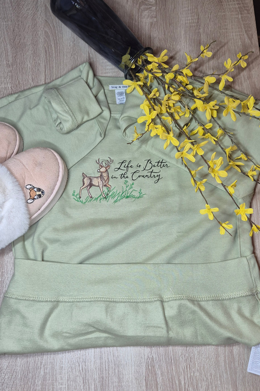Green sweatshirt with deer embroidery