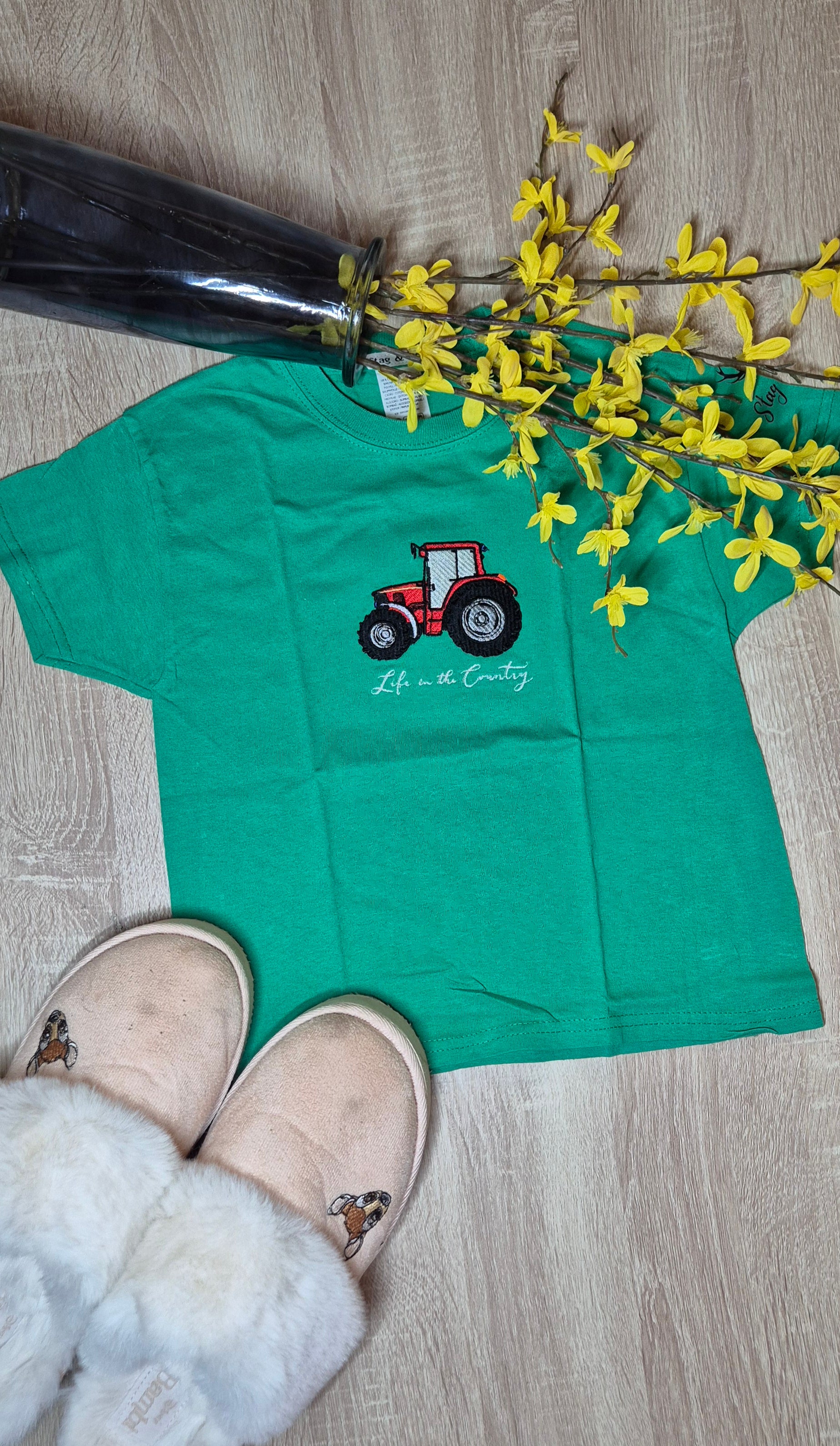 Green t-shirt with a red tractor embroidery