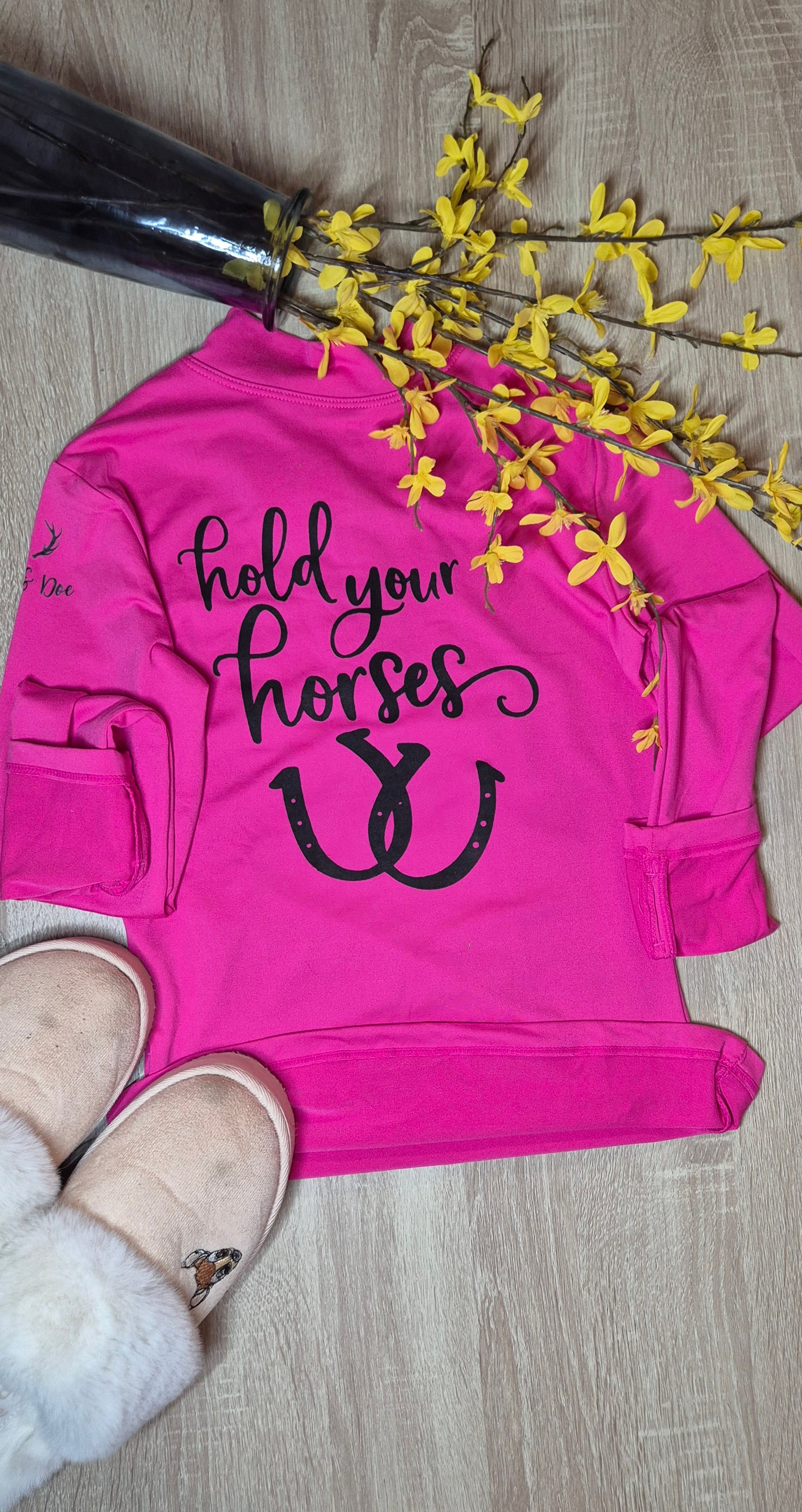 Pink t-shirt with 'hold your horses' text and horseshoe design 