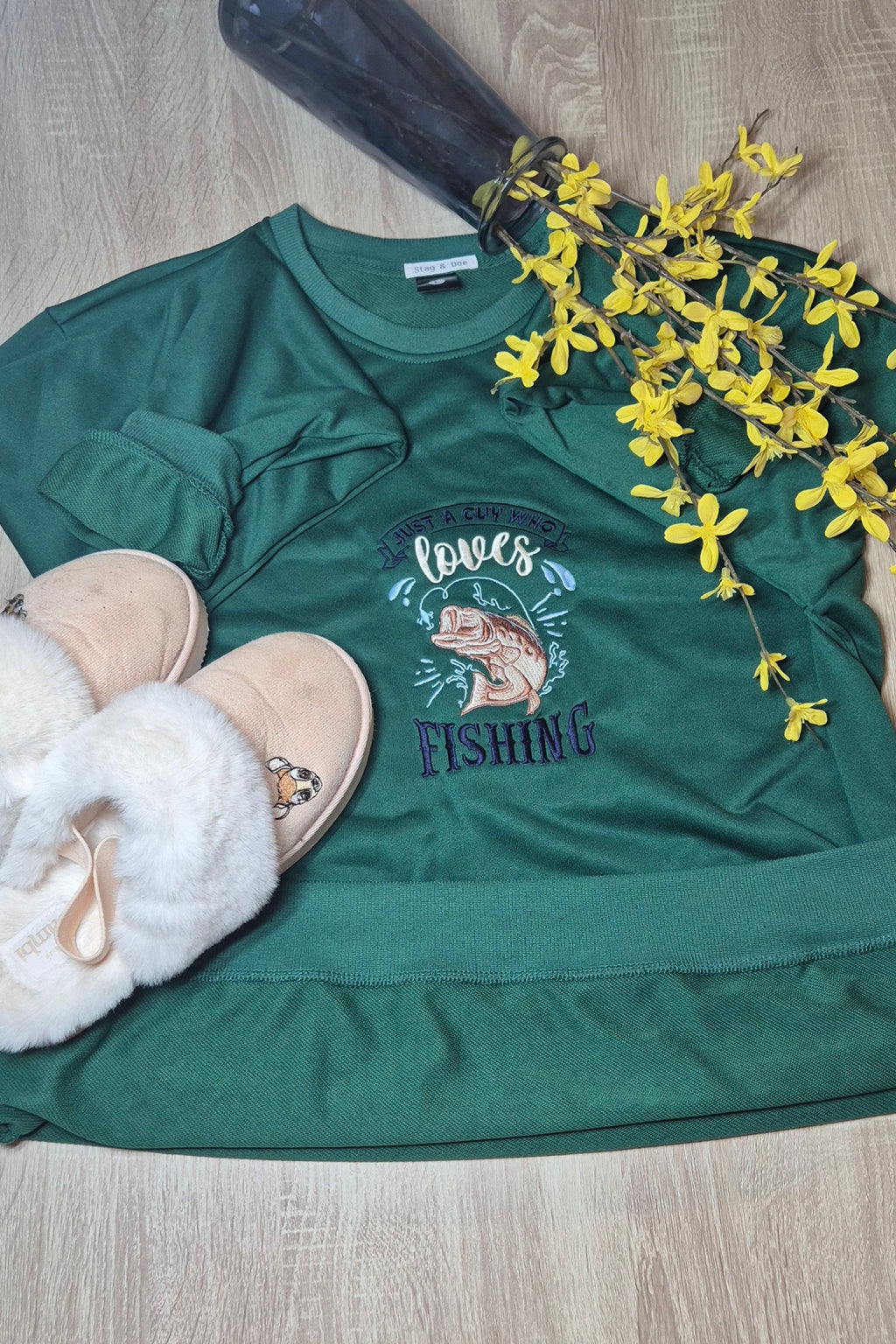 Green sweatshirt with fishing design